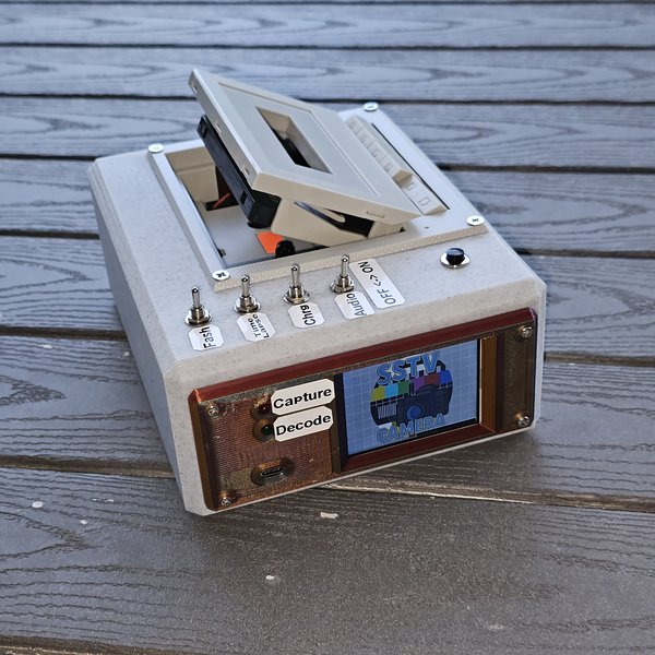 Camera that captures photos to cassette tape